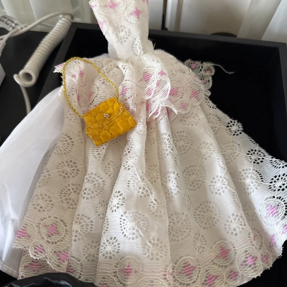 Lotof Barbie‎ doll clothesincluding 1 gown, o1 purse, a tuxedo Coat shirt, &more